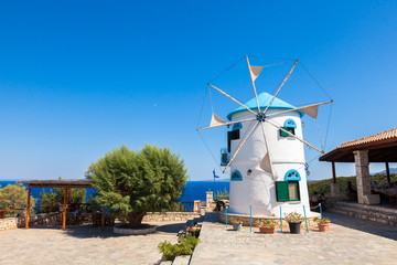 Fototapeta na wymiar Old Windmill in Agios Nikolaos near blue caves in Zakynthos (Zante) island, in Greece