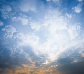 Blue sky with clouds and sun reflection in water with place for your text