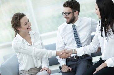 handshake of manager and client in the office lobby