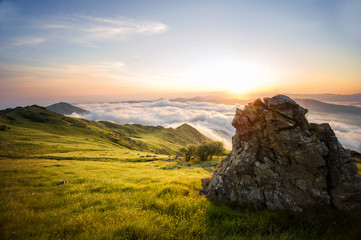 The Big Rock: A stunning view from above Mountains and Clouds while the Sun rises, Geopark del Beigua, UNESCO protected, Savona Province, Liguria, Italy, Europe