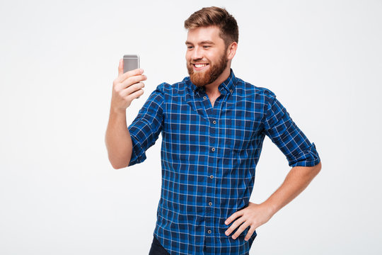 Picture of Smiling bearded man in checkered shirt