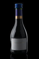 Wine bottle closeup on black background