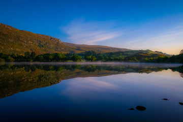 Giant mirror: as every passing morning, this mountain gets up and watches itself in the Mirror, Gougane Barra, County Cork, Ireland.