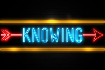 Knowing  - fluorescent Neon Sign on brickwall Front view