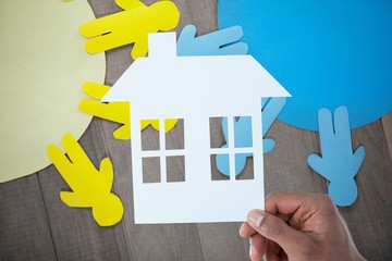 Blue and yellow paper cut out figures on table