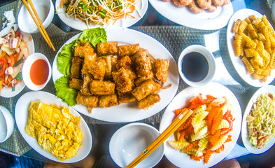 vietnamese food on table, spring rolls, eggs, shrimps