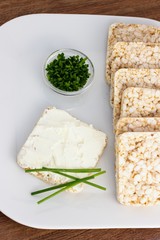 Rice cakes with cream cheese and chives