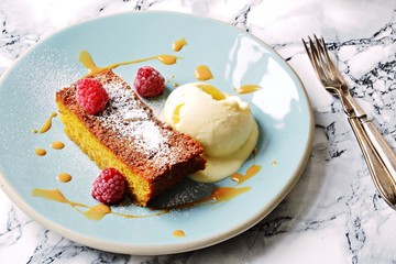 Orange polenta cake with goat cheese ice cream and caramel