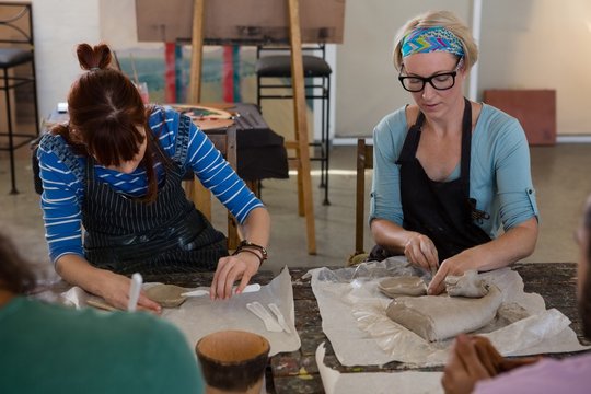 Female craftsperson practicing in art studio
