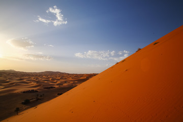 Fototapeta na wymiar Camp of Camel caravan going through the sand dunes in the Sahara Desert, Marrakech,Morocco.Africa