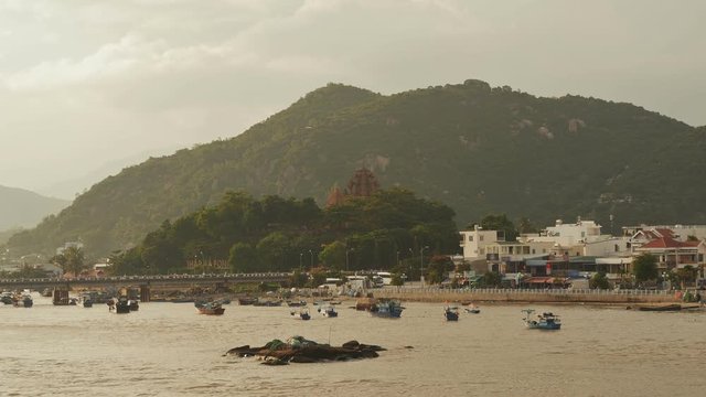 Old cham towers, bridge and boats in Nha Trang, Vietnam