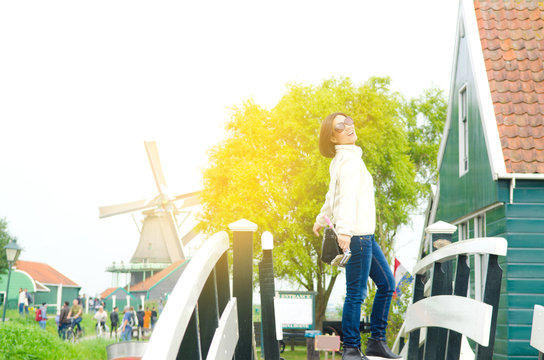 Asian woman enjoyed her holiday in Zaanse Schans, Netherlands