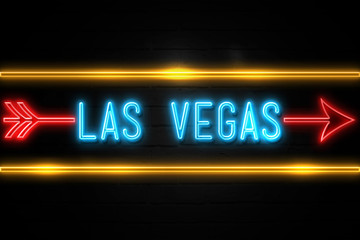 Fototapeta premium Las Vegas - fluorescent Neon Sign on brickwall Front view