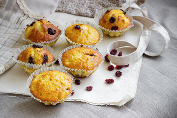Homemade muffins with raisins on the burlap cloth