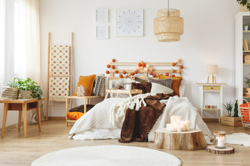Messy bed in bedroom
