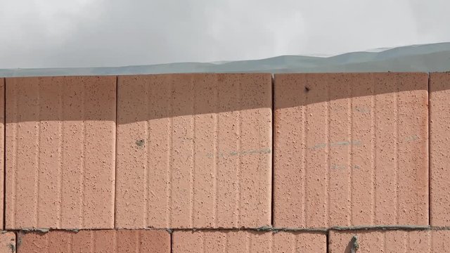 brickwork covered with foil