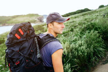 Man Traveler with backpack Freedom Lifestyle concept