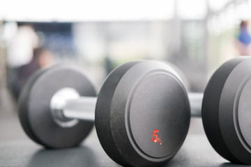 dumbbell in gym or health club. sport, training, fitness lifestyle concept