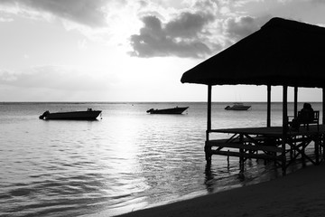 Resting on remote Paradise beach,Mauritius island.black and white.
