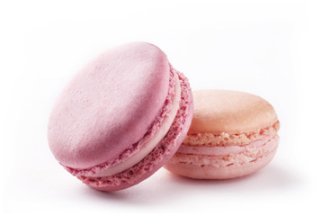 Colorful macarons on a white background. French sweets couple on white paper