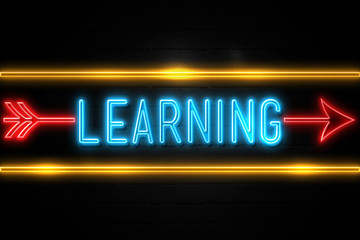 Learning  - fluorescent Neon Sign on brickwall Front view