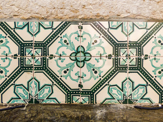 Beautiful green Portuguese tiles (azulejos) with flower pattern in Lisbon