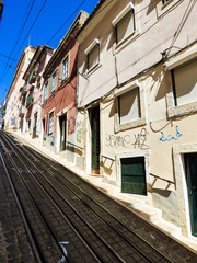 Fototapeta na wymiar Calcada da Bica Grande street with funicular railway in Lisbon