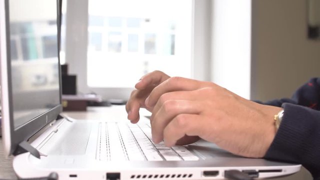 people, business, technology and office work concept - close up of businessman hands typing on computer keyboard.