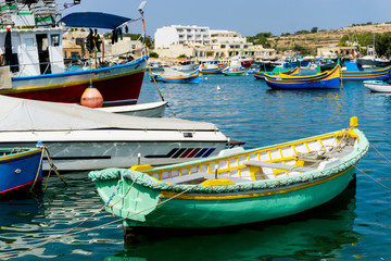 Fototapeta na wymiar Mediterranean traditional colorful boats in Malta