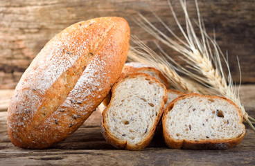 bread and wheat on the wooden