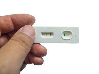 Man is holding positive pregnancy test in his hand isolated on white background.
