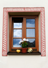 Beautiful country house window with flowers