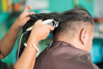 Fototapeta premium Man hair cut in the barber