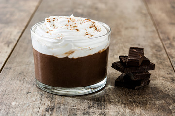 Chocolate mousse on wooden table. Copyspace.

