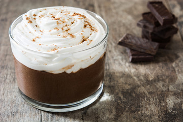 Chocolate mousse on wooden table. Copyspace.

