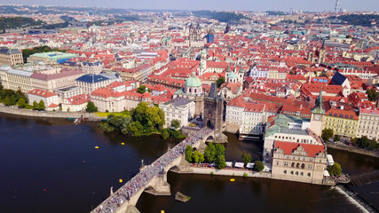 Fototapeta na wymiar Prague, Czech Republic - Beautiful summer’s day over the city, including Charles Bridge and Prague one municipal district 