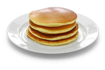 Fototapeta na wymiar a stack of pancakes on a white dish isolated on white background