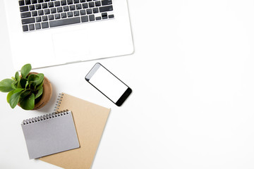 on desk office table top left have phone smart phone isolated near notebook grey brown and laptop computer open keyboard touch