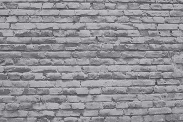 brick wall covered with neutral gray lime