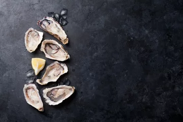Zelfklevend Fotobehang Oysters and lemon © karandaev
