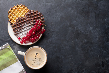 Coffee and waffles with berries