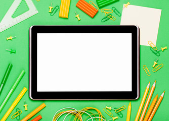 Tablet on a green background