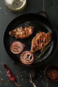 Grilled steak of pork with spices, rosemary and chili pepper