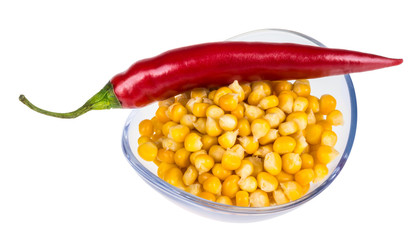 Bowl with corn and hot pepper. Yellow corn and red pepper in glass bowl isolated on white background.