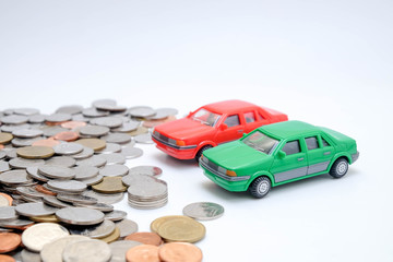 save money for investment concept Toy car and stack of coins