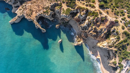 Aerial. Rocky shore formation and beaches of Portimao. View from sky. © Sergo