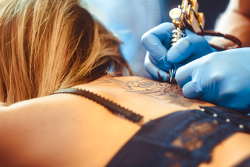 master tattoo woman on her back