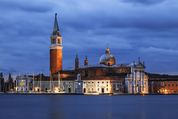 Fototapeta premium A view of the Cathedral of San Giorgio Maggiore from San Marco square at night, Venice, Italy