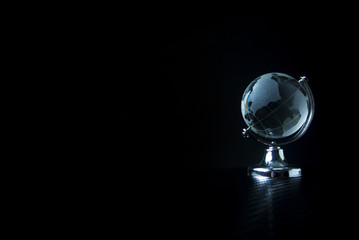global world glass on black background