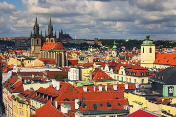 Obraz premium Amazing view of the center of Prague from the Powder Tower. In the foreground there are towers of Church of Our Lady before Tyn. On the horizon is visible Prague Castle with St. Vitus Cathedral